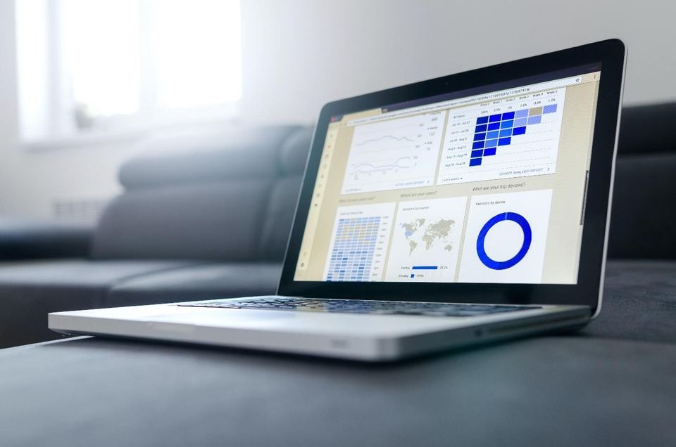 Laptop with website analytics charts, the kind of data an SEO audit reviews